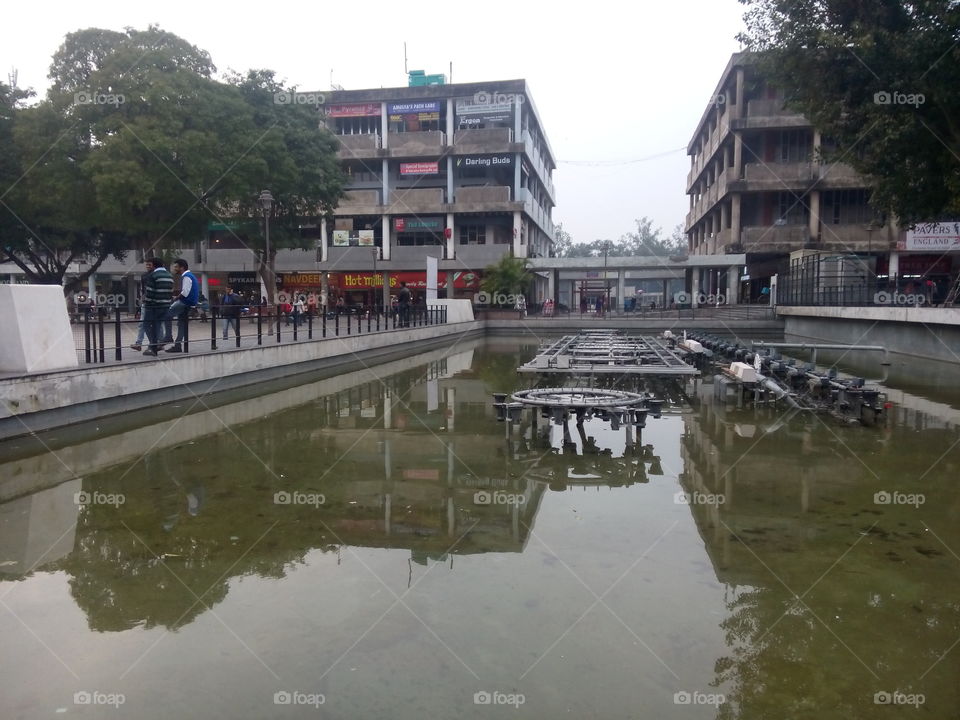 water fountain building people festival crowd sale walking around