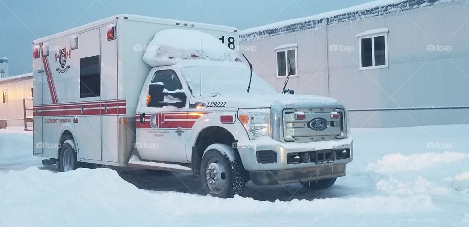 ambulance in the snow, waiting for a call, cold weather saftey. cold