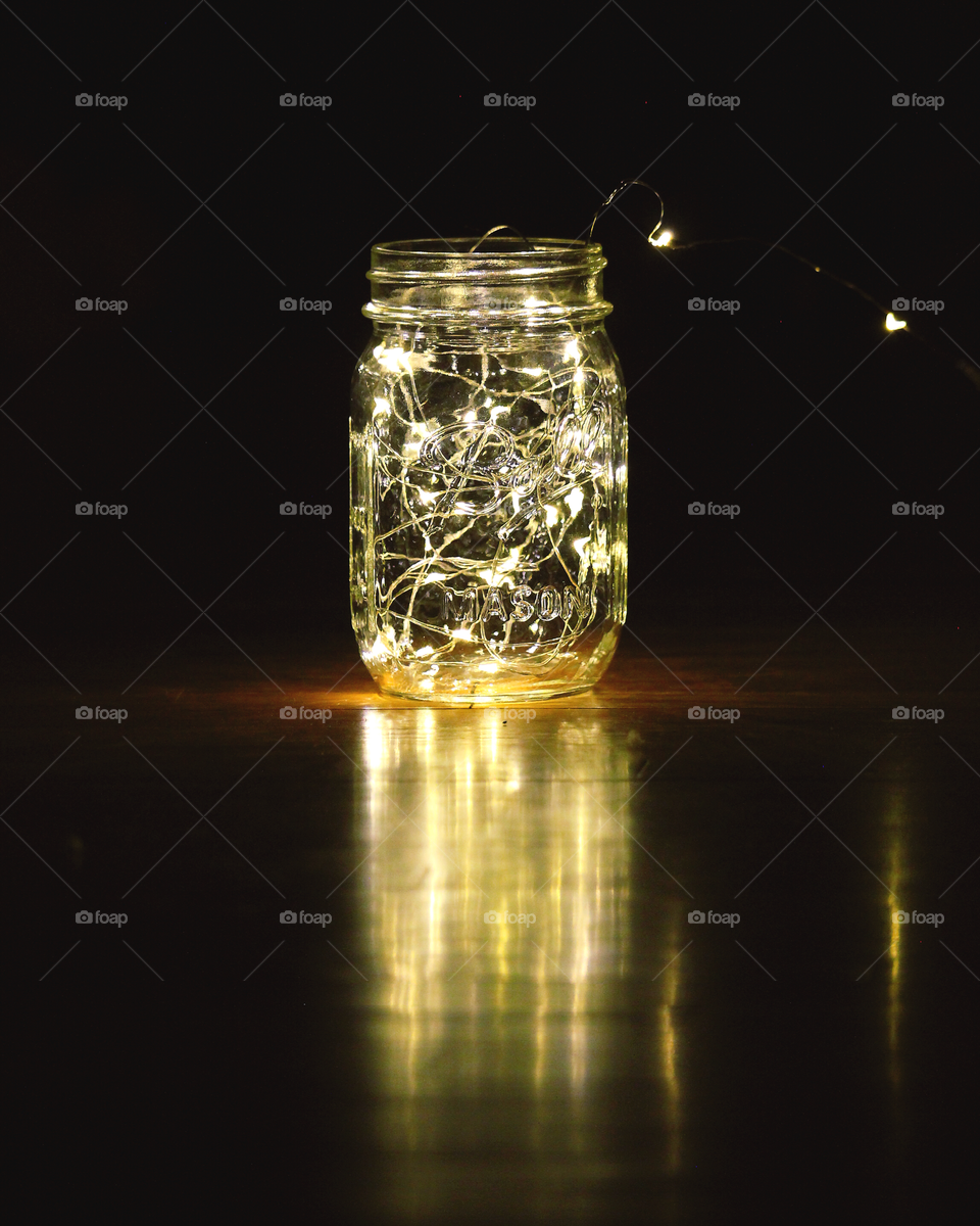 Jar full of lights with a reflection. 