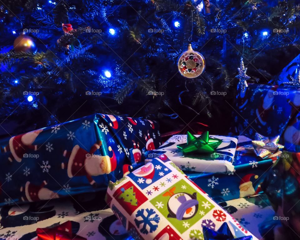Gift boxes near christmas tree