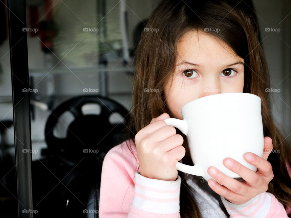 Girl drinking hot cocoa