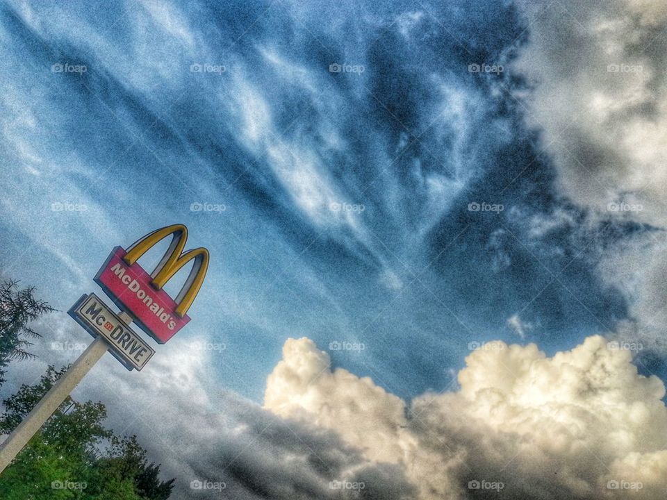 McDonald's logo and clouds