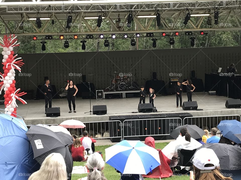 Dancers dressed in black perform at Bower Ponds for Canada Day.