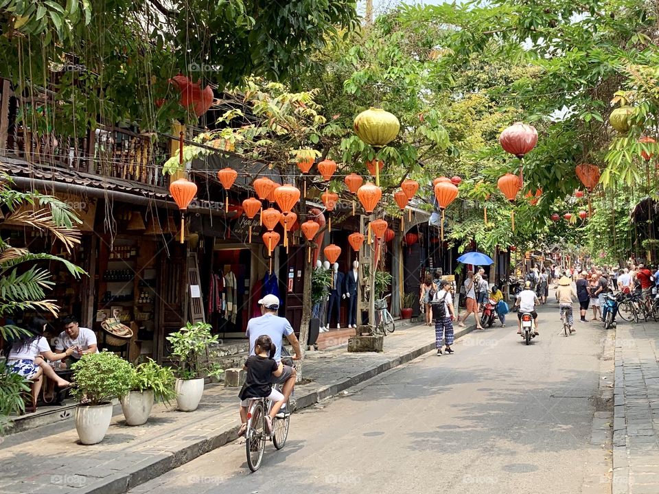 Cycling tourists in Old Town, Hoi An, Vietnam 
