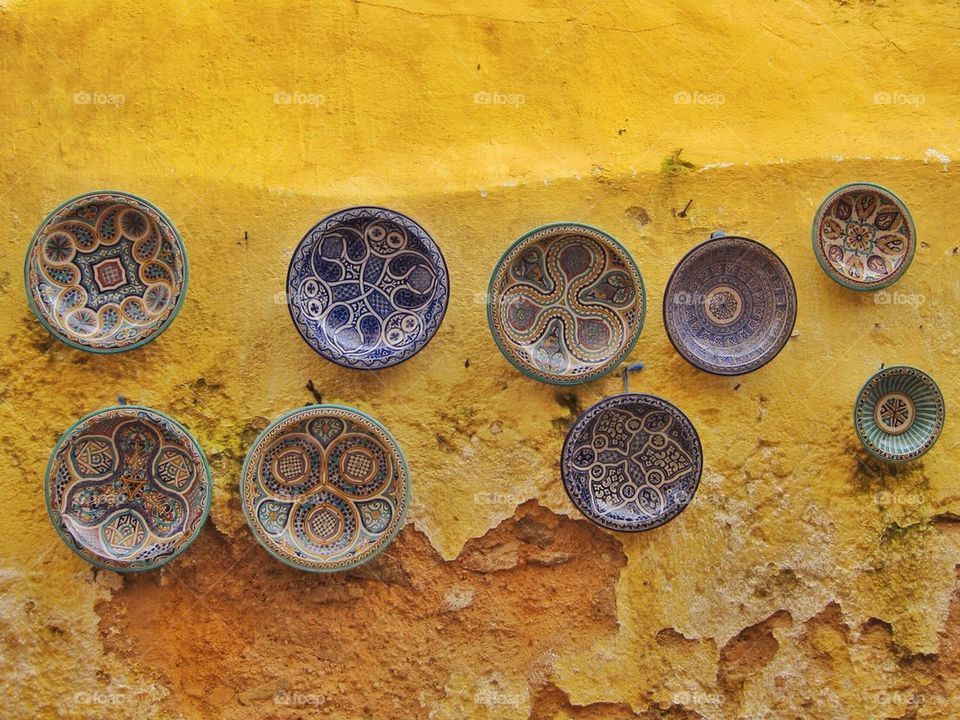 Moroccan plates on a yellow wall