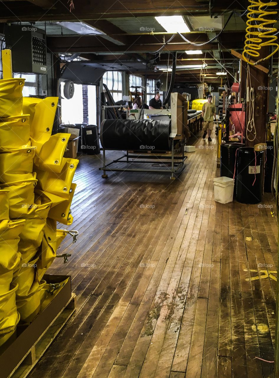 Factory floor. This building is over 100 years old.  Wooden floors, brick walls, still viable after all those years. 