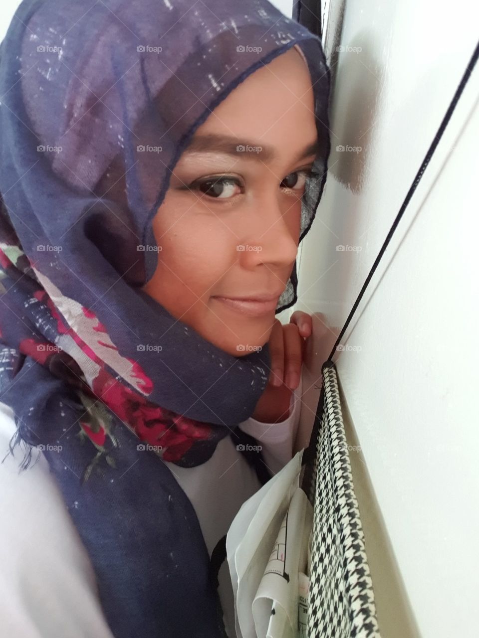 Selfie looking sideways wearing hijab
