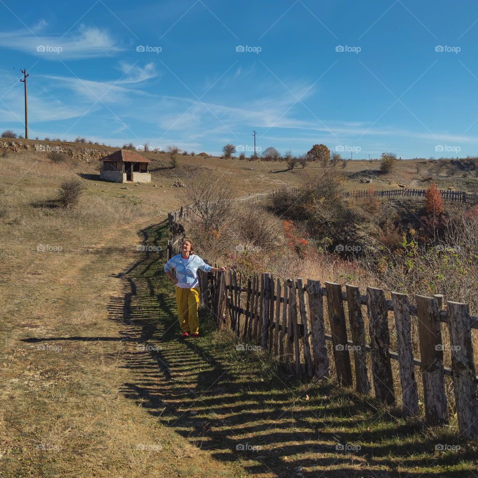 Shadows of the village fence