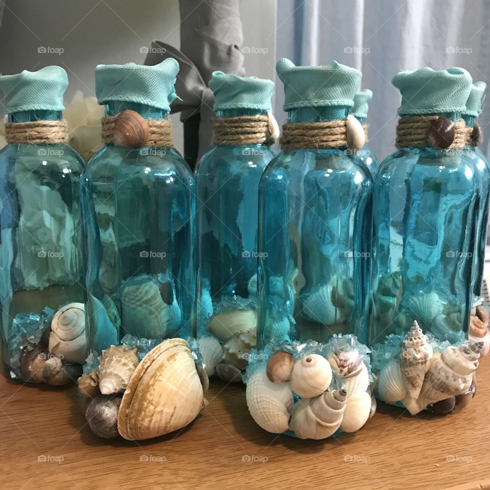 Class bottle design with sea shells