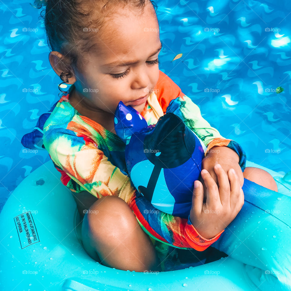 child playing and having fun in swimming pool