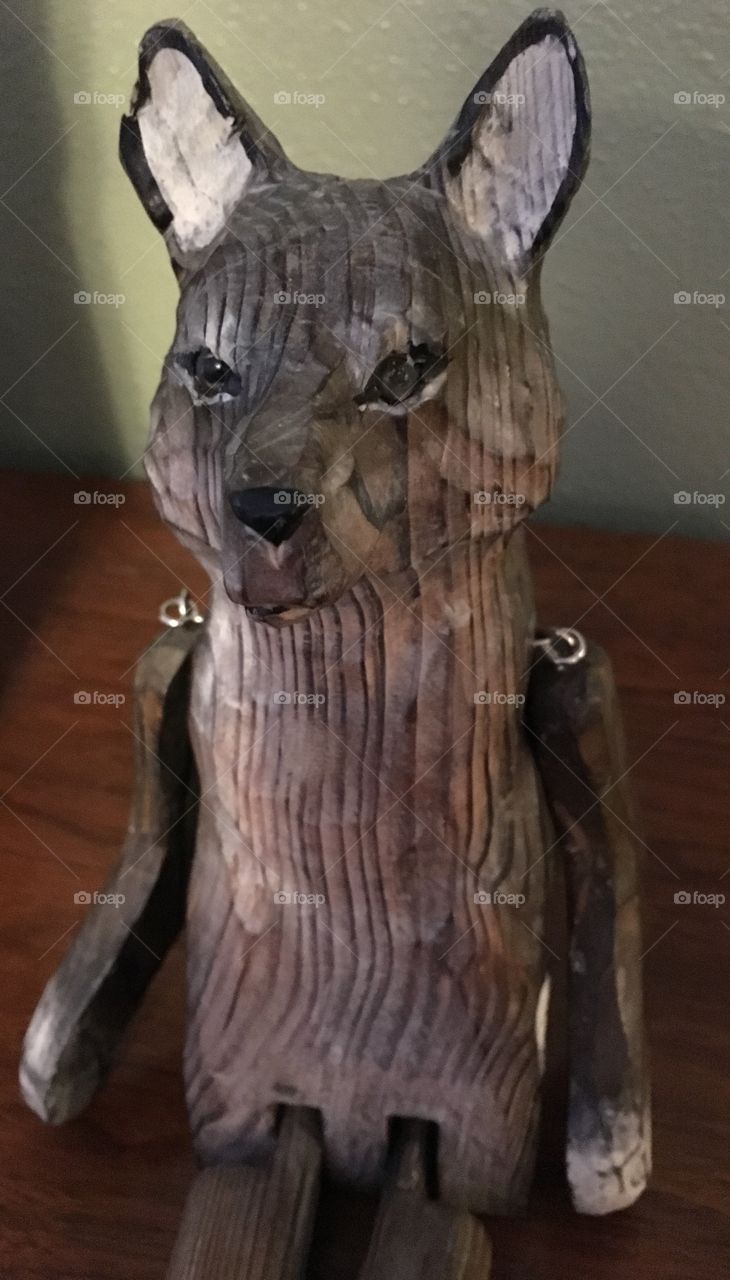 A neat wooden wolf in my living room.