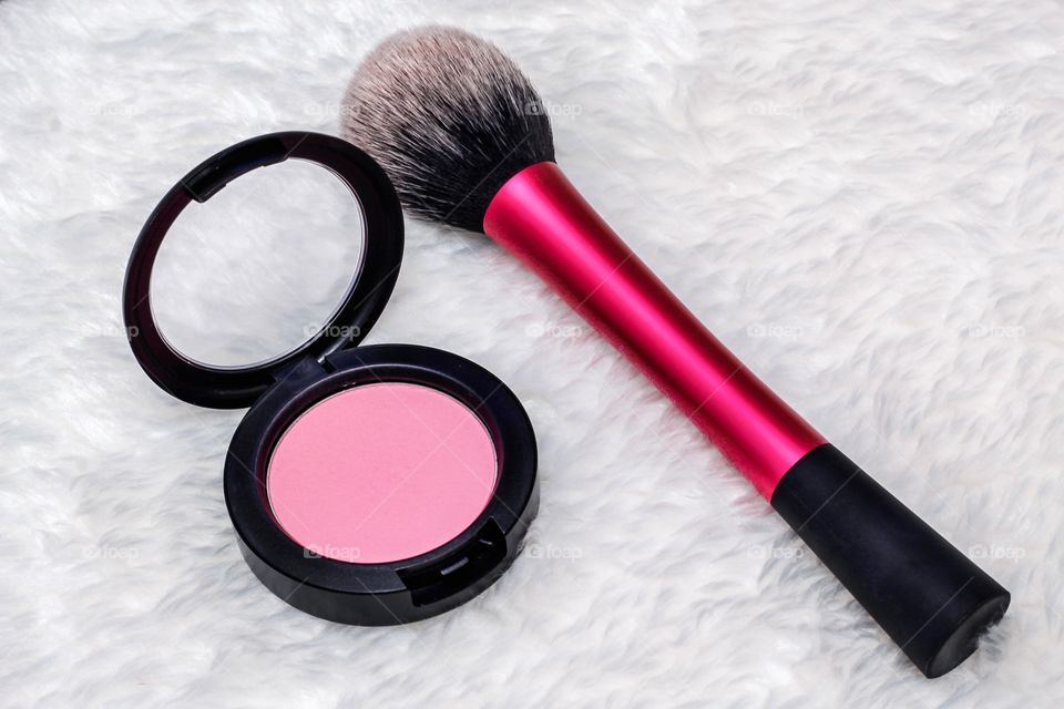 Pink blush and powder brush 