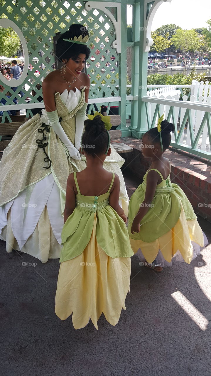 Bride standing with two little girls at outdoors