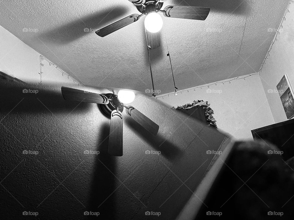 Ceiling fan reflection off a glass cell phone cover 