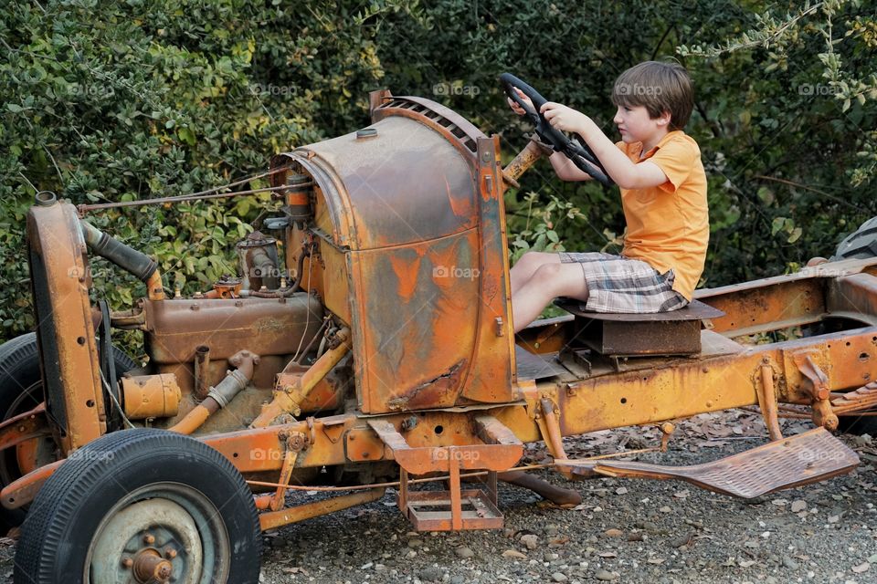 Boy Driving Vintage Car