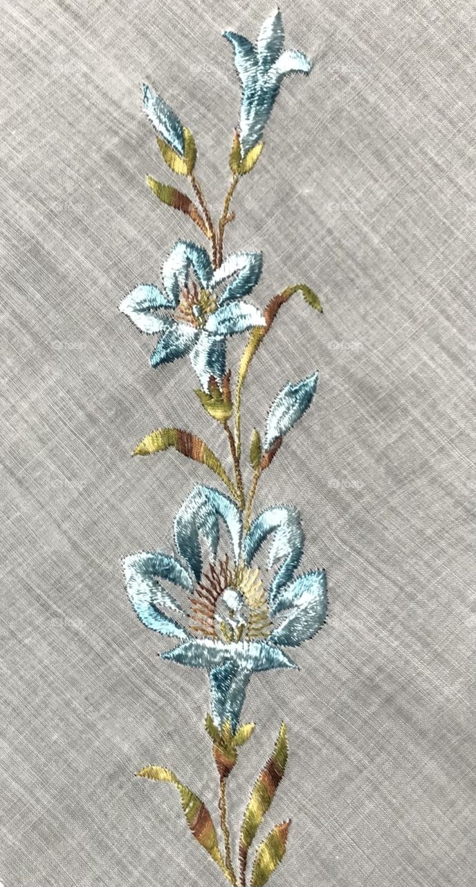 Shiny iridescent machine embroidered floral design