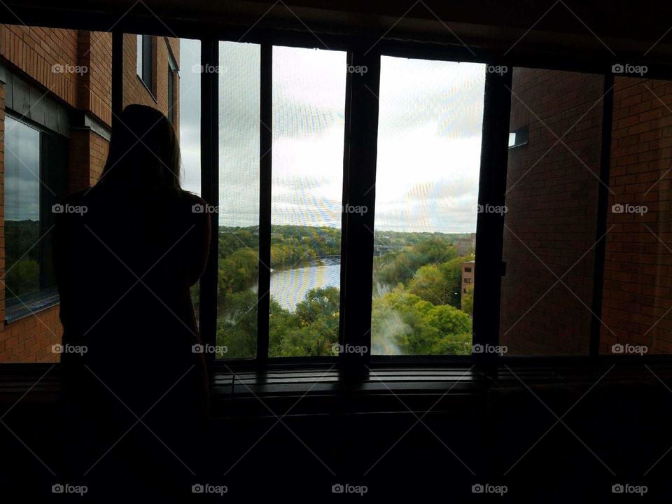 A silhouetted friend overlooking the Mississippi River on a bleak afternoon