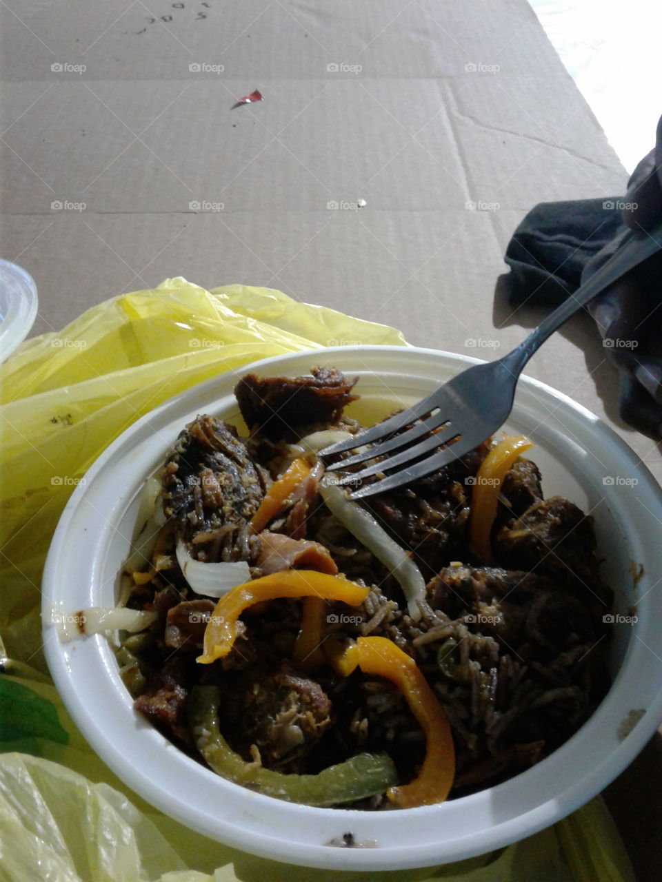 Haitian food ,black rice with beef /lambi