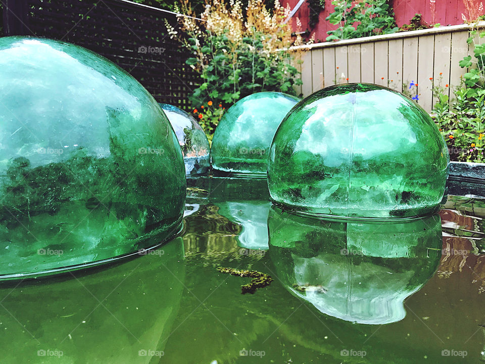 Glass spheres floating on water 