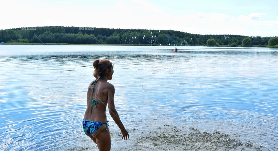 splash water lake girl relaxing on a nature summer heat, summer vacation