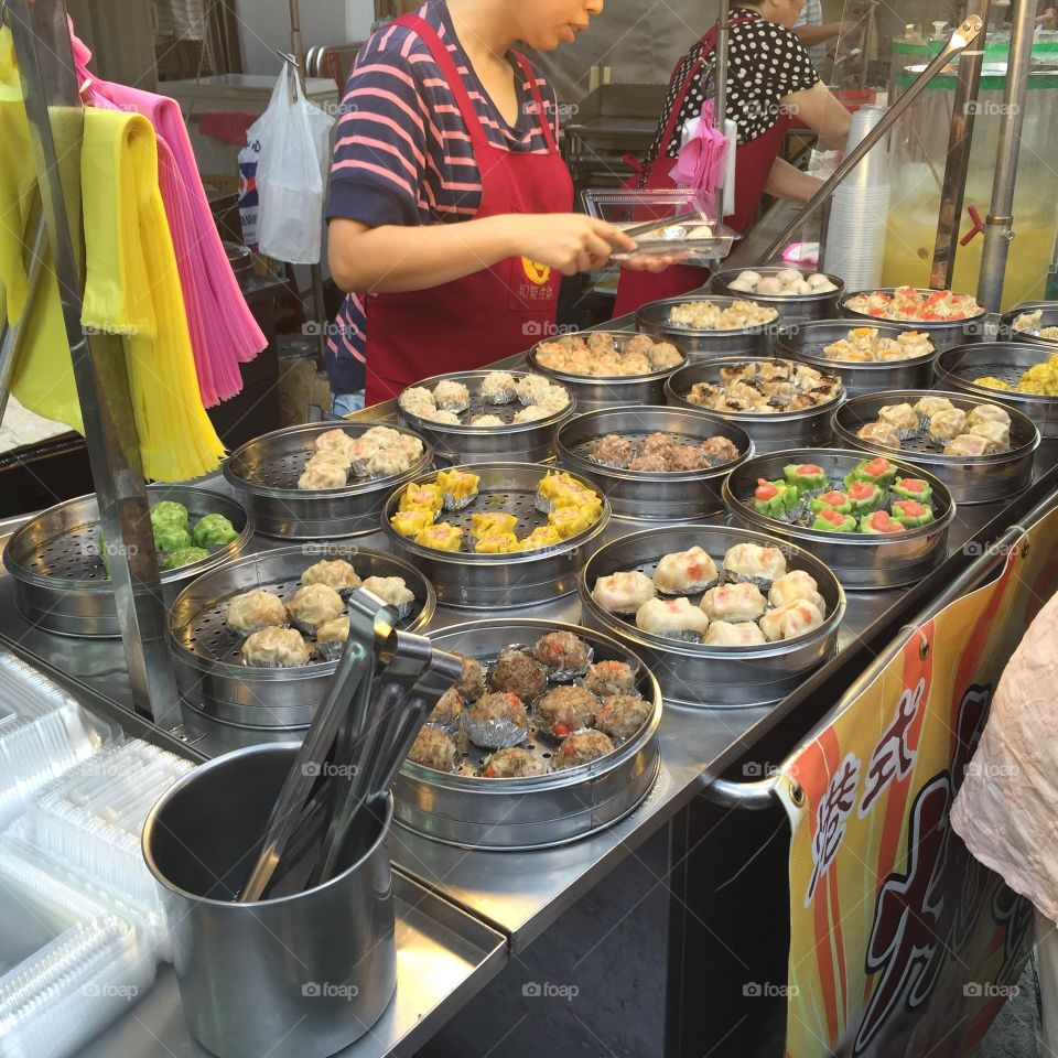Street food dumplings Taiwan . A night market in Keelung sells fresh steamed dumplings on the street