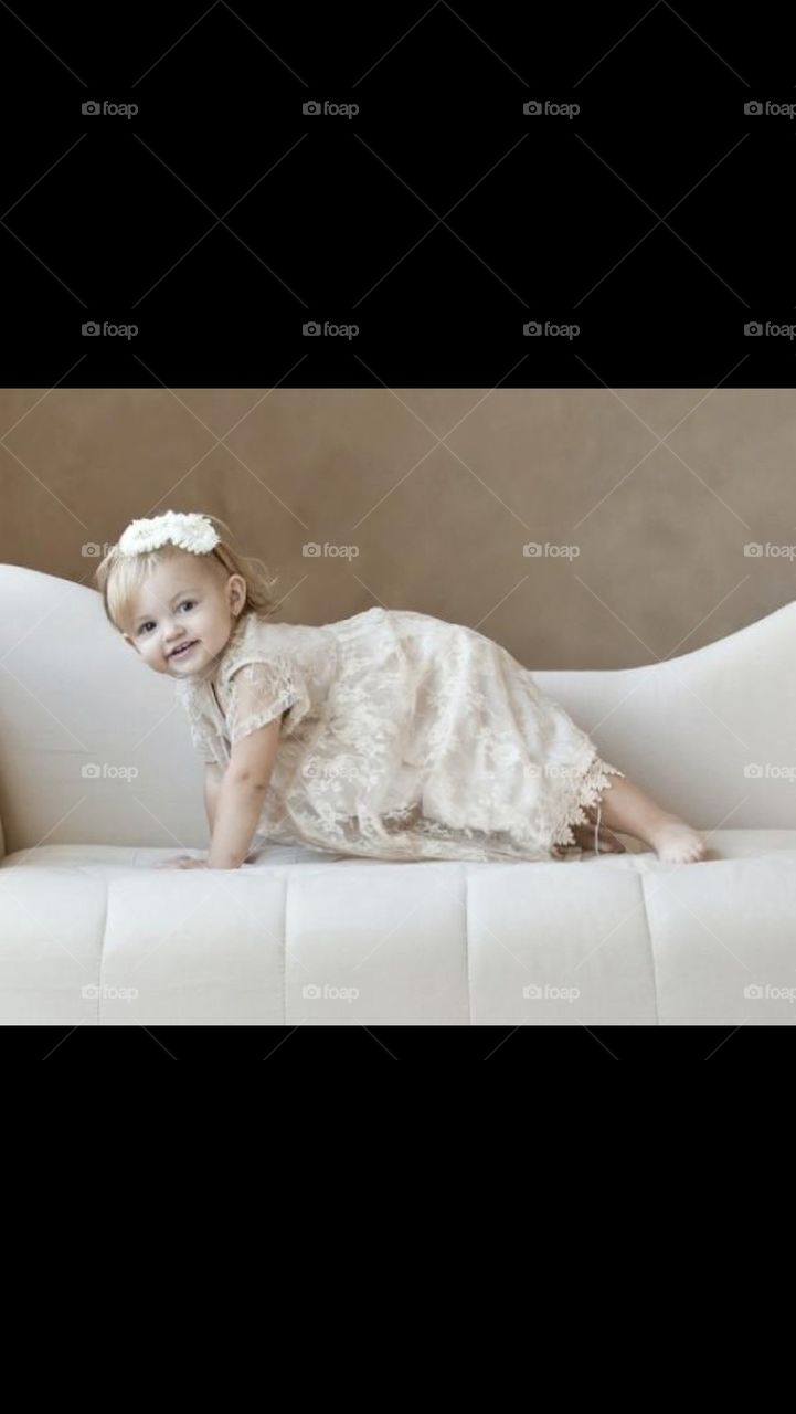 Little Girl Playing on the Couch