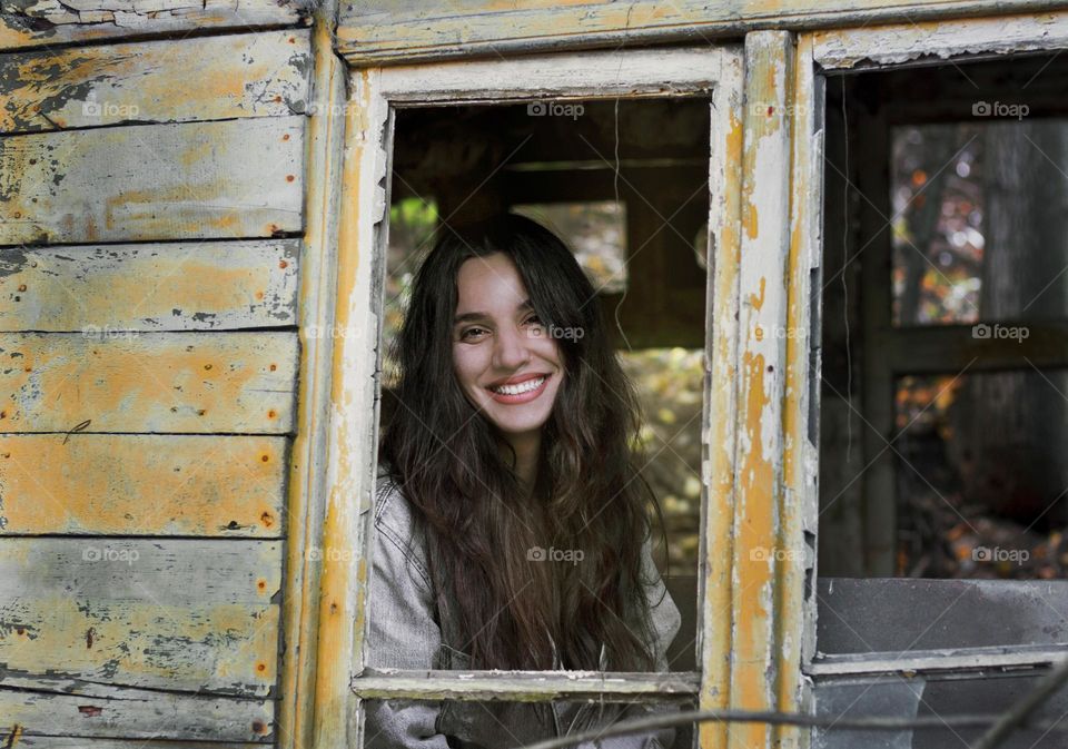 Beautiful woman smiling in window