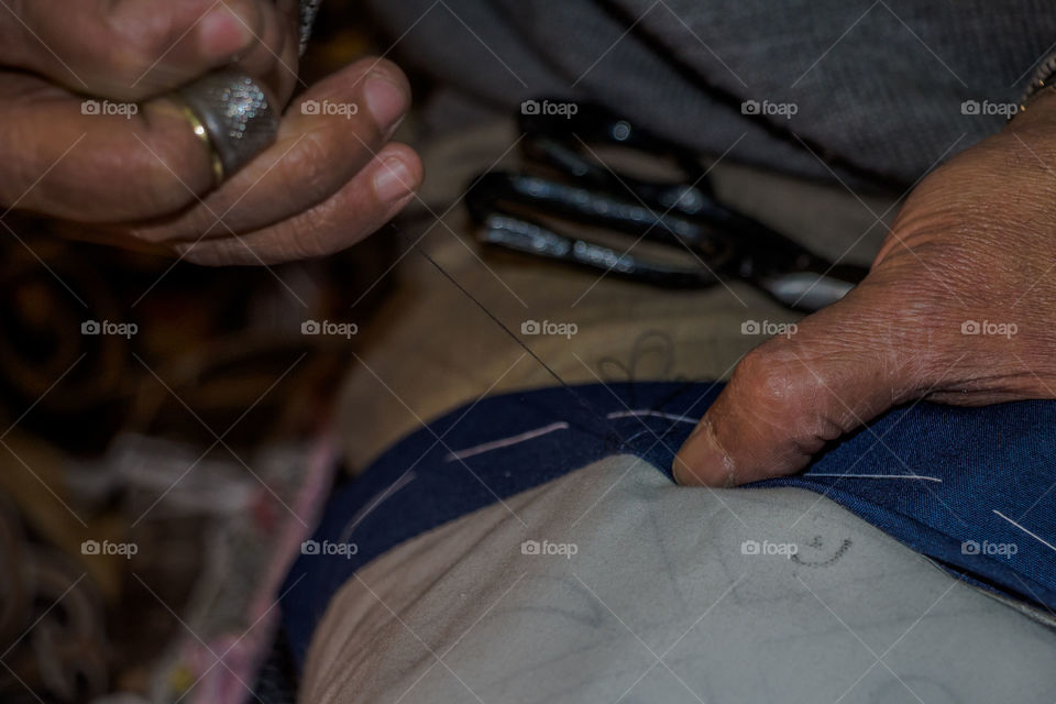 A person sewing cloth