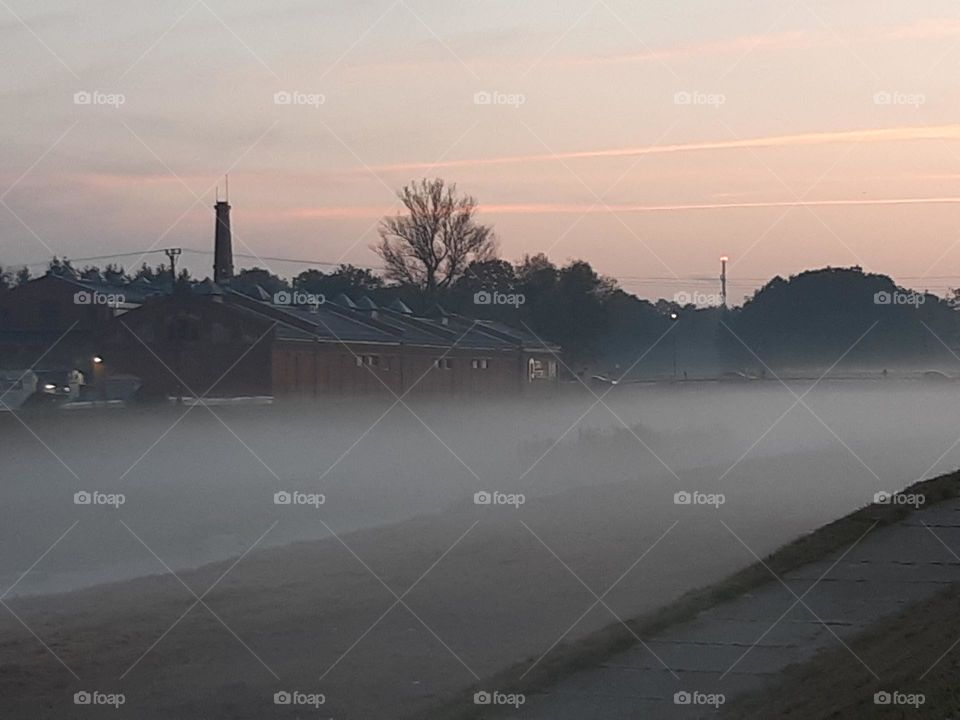 big fog light chimney during sunset in autumn