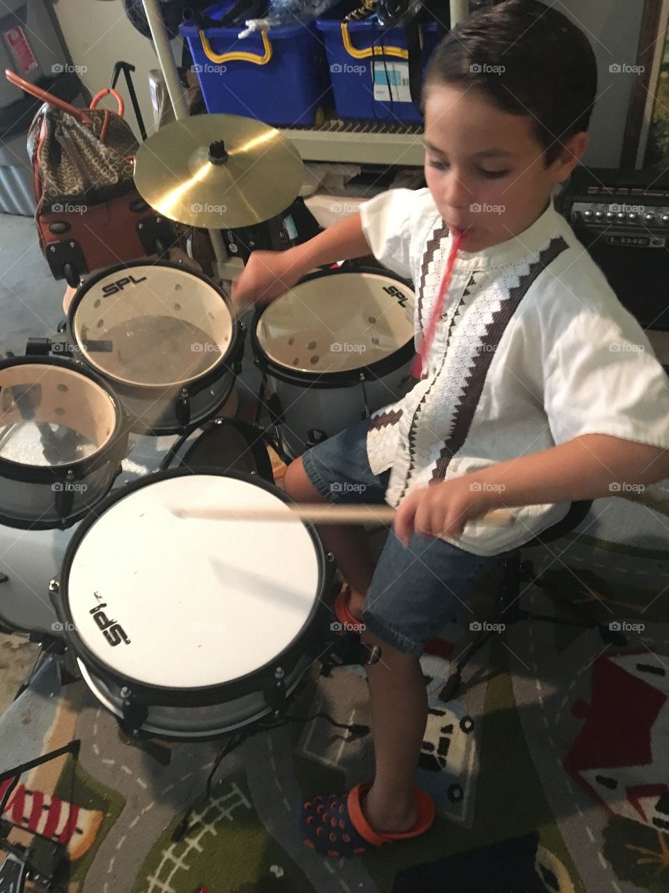 Autistic is powerful, kid playing the drums 