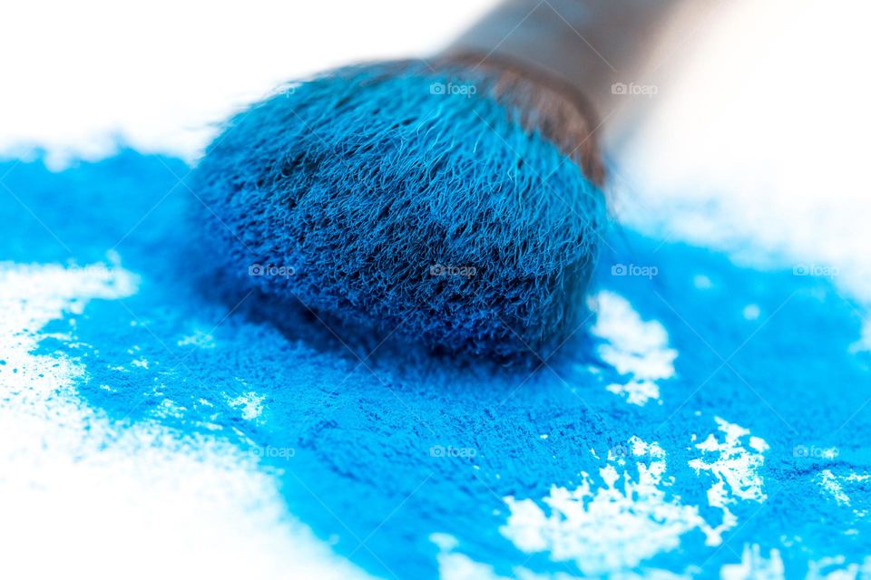 Objects - make up brush with blue make up powder close up