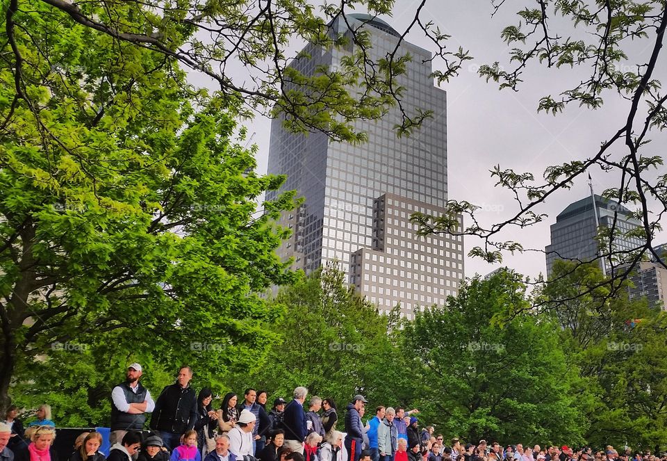 People enjoying boat race in New York