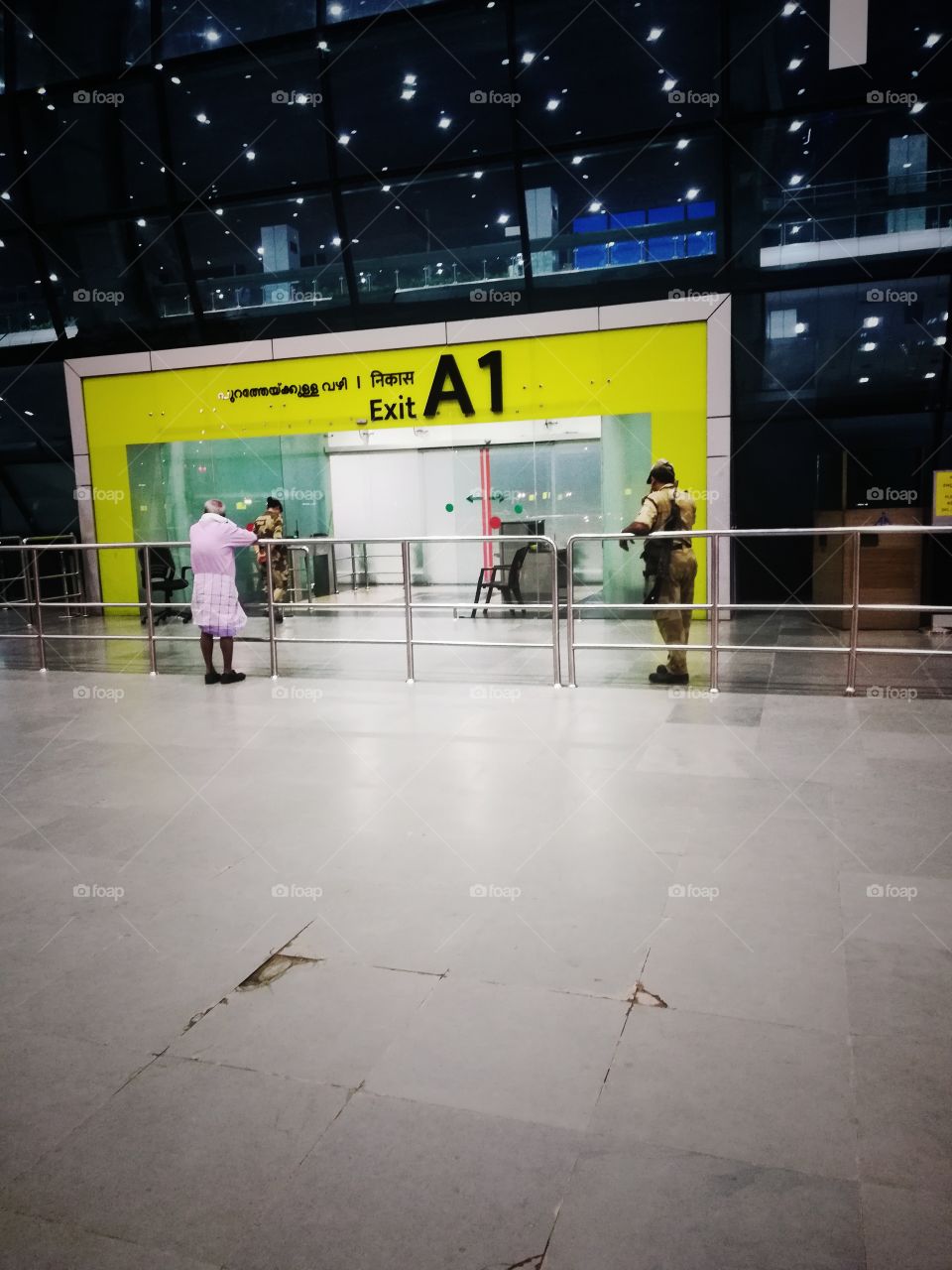 the airport exit way the single old man expected to waiting some one long time