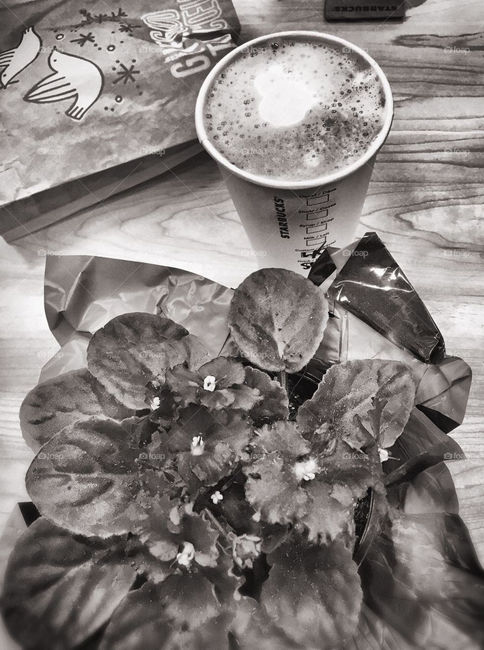 The beautiful aroma of a latte and a beautiful flower