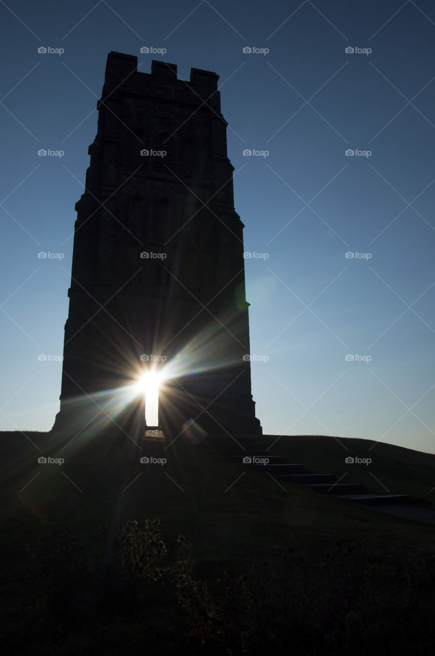 sun light behind the arch