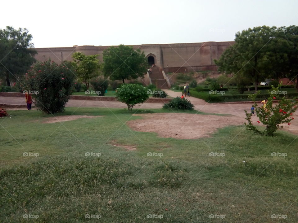 a little boy playing in an ancient fort of Bathinda city- a monument protected by Govt Of India- inner part
