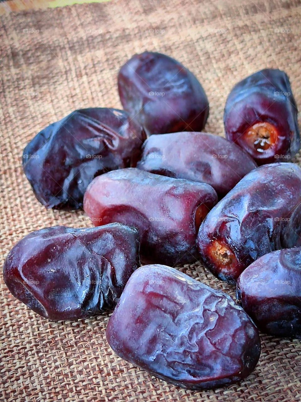 Oriental sweets. Purple the edible fruit of the date palm