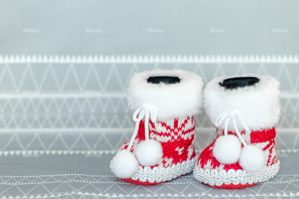 Red Santa knitted shoes, Christmas decoration closeup