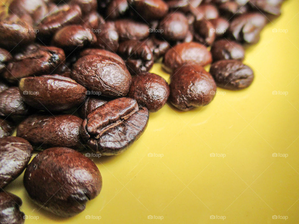 coffee beans. coffee beans on yellow background