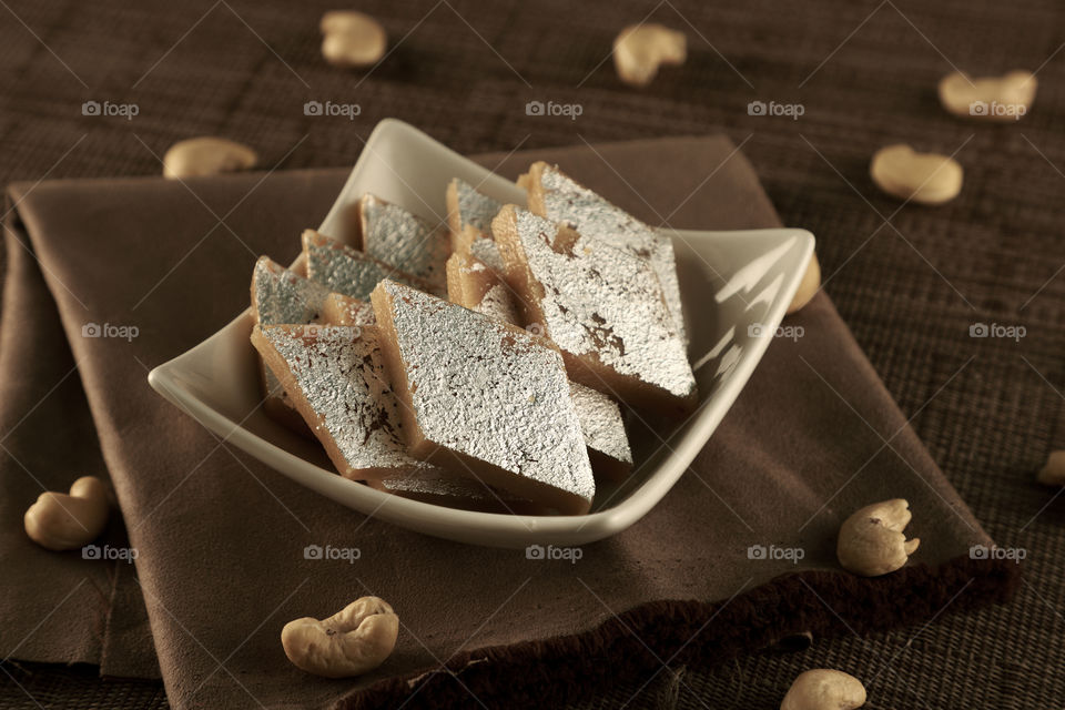 Indian sweet kaju Katli in a White bowl