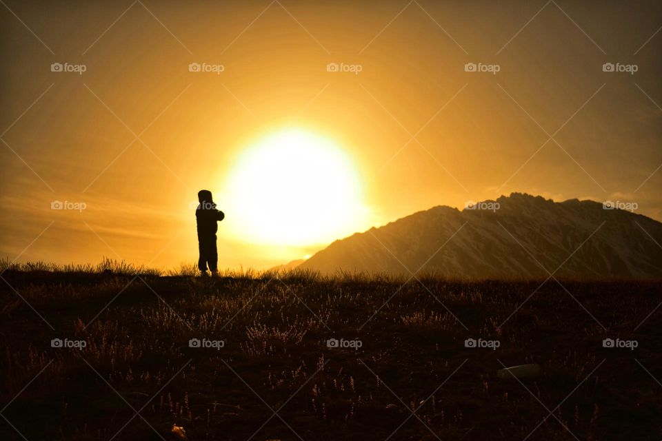 silhouette of a man enjoying the magical landscape