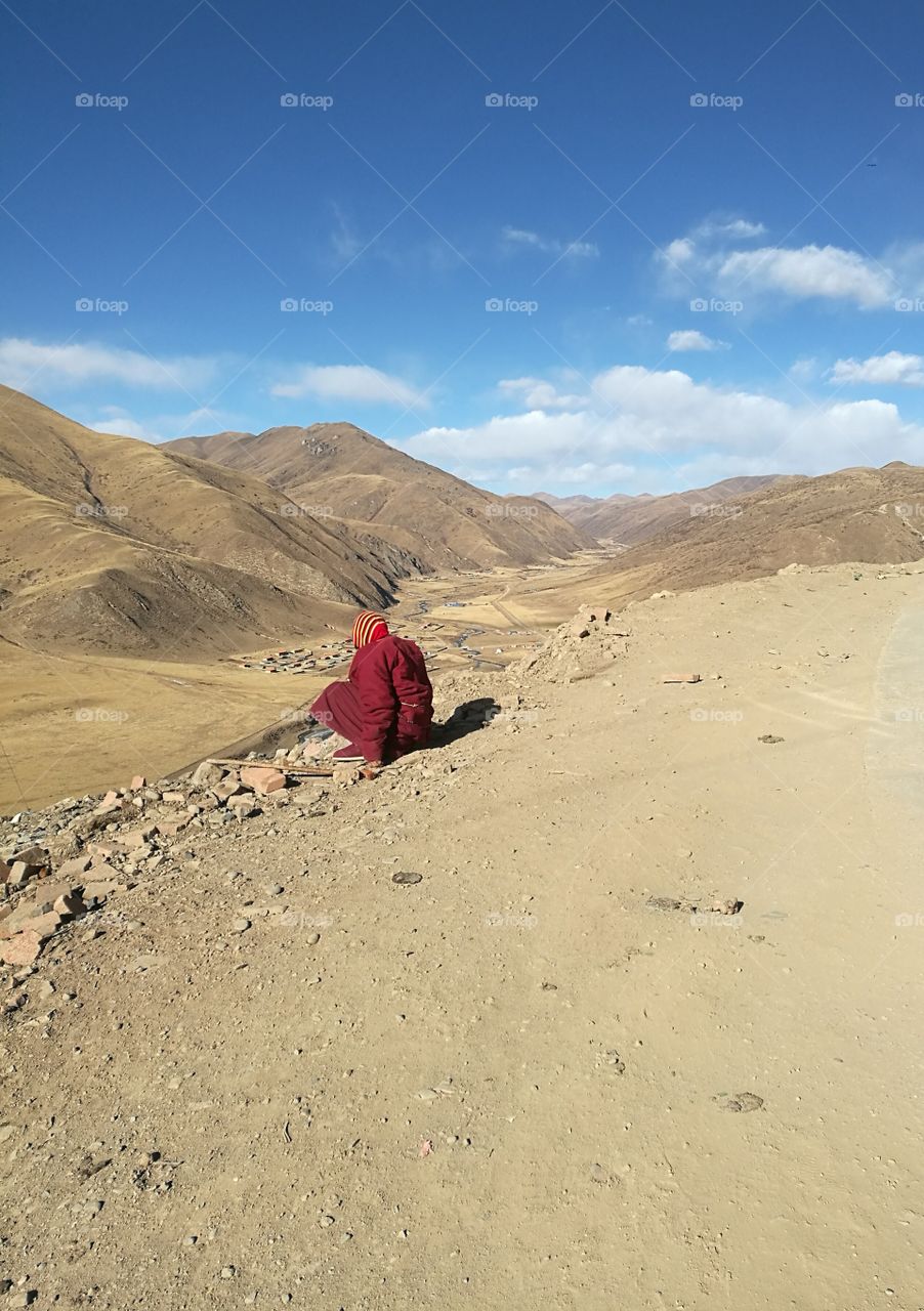 Nun staring into the Valley at Se Da Buddhist Monastery and School in Sichuan Province, China.
Se Da is currently the largest Tibetan Buddhist school in the world and not open to westerners.