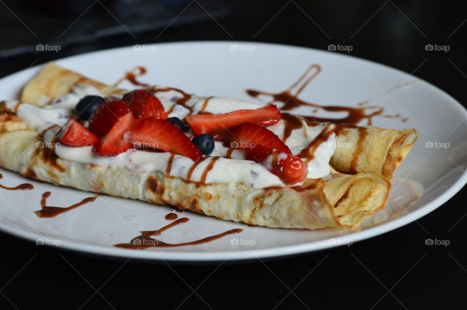 pancakes with nonfat yogurt and fresh fruits strawberry and berry