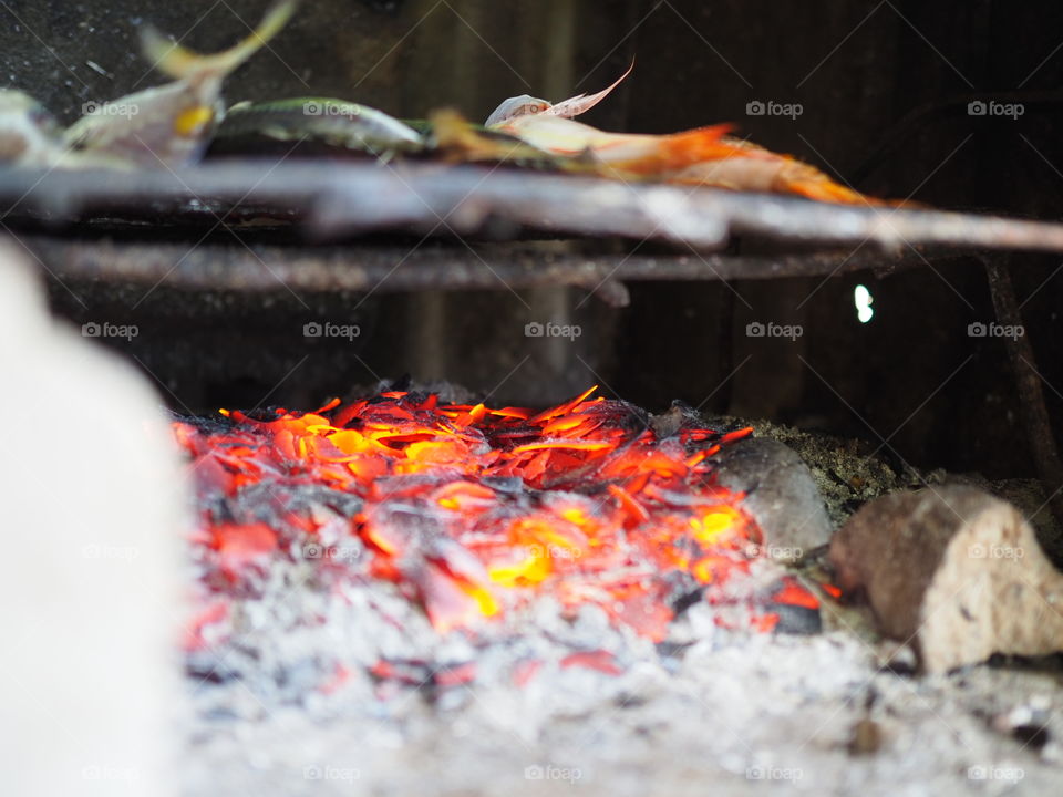 Cooking fish in a coal