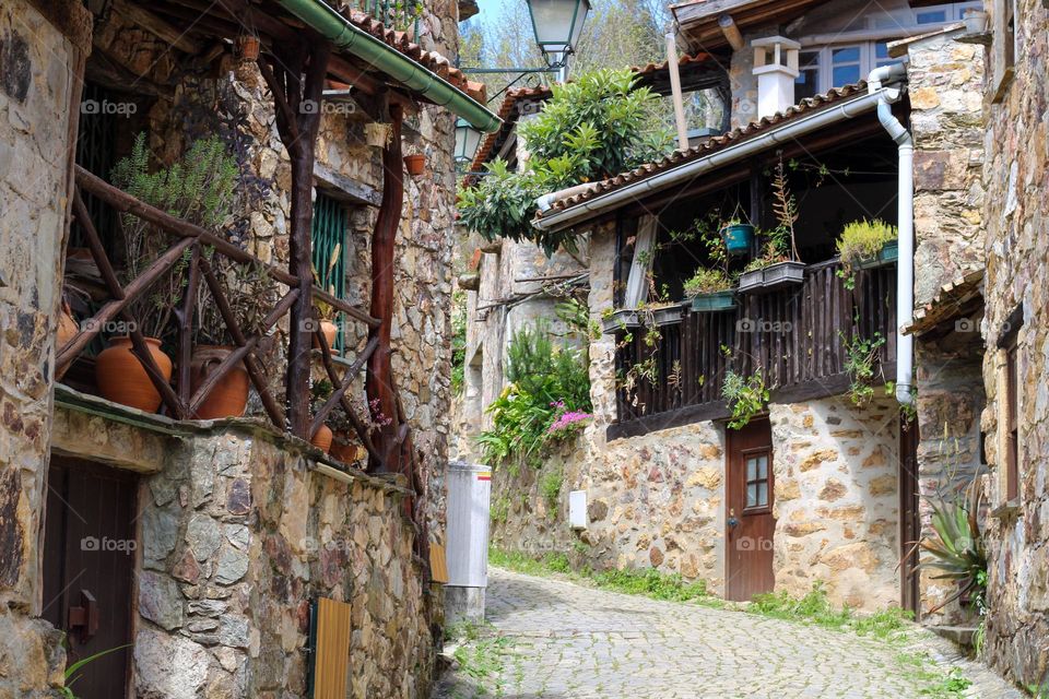 Small shale village in Portugal.  In the beginning of spring, many flowers decorate the houses in the village.