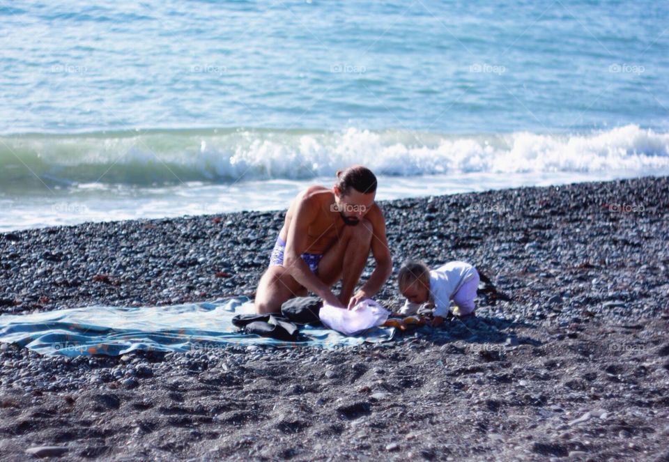 Father with daughter at the seaside 