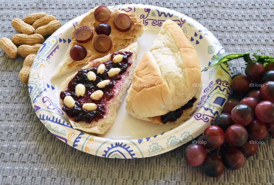 Peanut Butter and Jelly sandwich with grapes and peanuts on a hoagie roll
