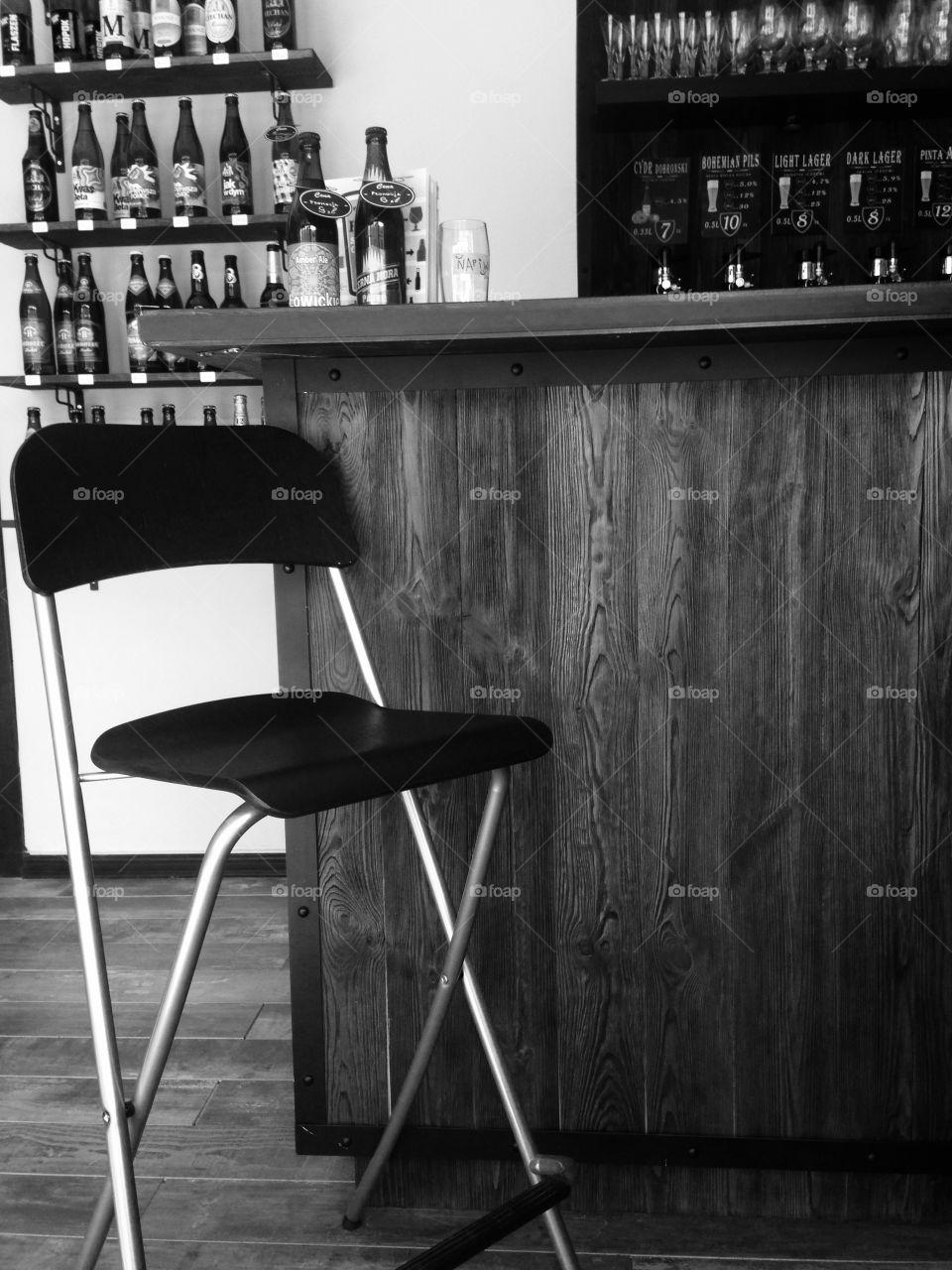 A chair in a beer bar. Black and white photo 