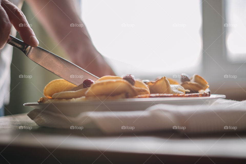 Woman cuts apple pie