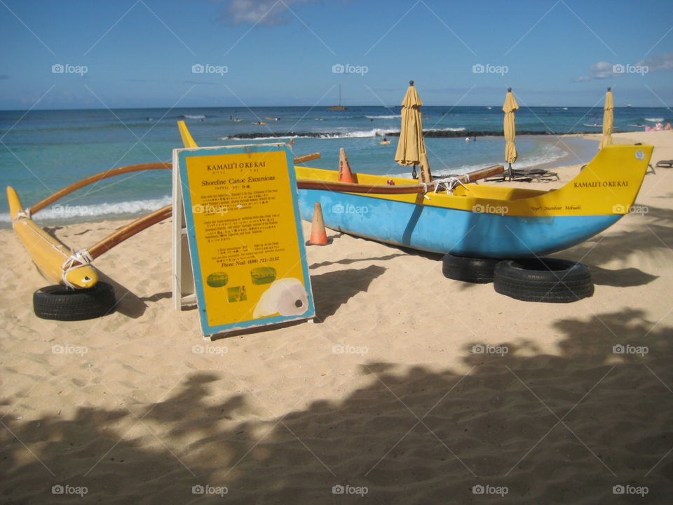 Beach scene. Outrigger canoe rental